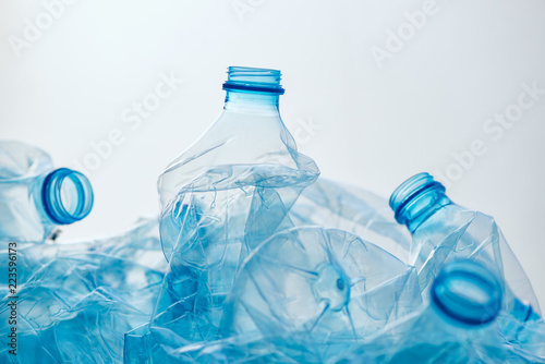 Crushed plastic bottles heap photo