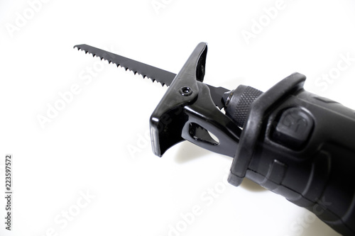 Reciprocating saw with a blade isolated in a white background