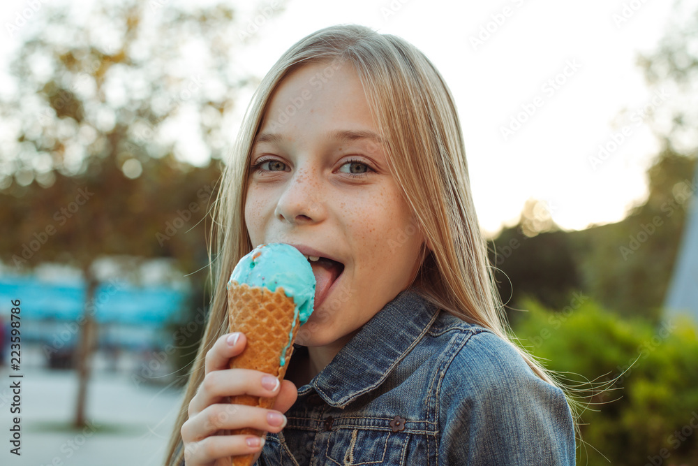 Beautiful little girl Licking an Ice Cream Stock Photo Adobe Stock