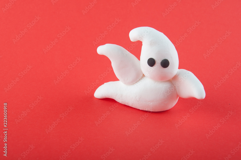 Funny white ghost made of modelling clay staying on red background. Copy paste, space for text Stock Photo | Adobe Stock Funny white ghost made of modelling clay staying on red background. Copy paste, space for text Stock Photo | Adobe Stock
