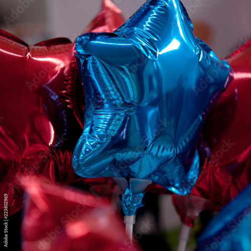 beautiful bright red and blue balloons in the form of stars
