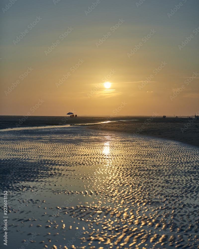 Photograph of a summer sunset on the beach of La Bota, Huelva
