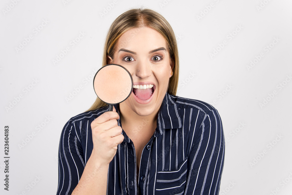 beautiful blond girl with perfect skin commercial face type holding magnifier beauty skin concept, size plus model beautiful blond girl with perfect skin commercial face type holding magnifier beauty skin concept, size plus model