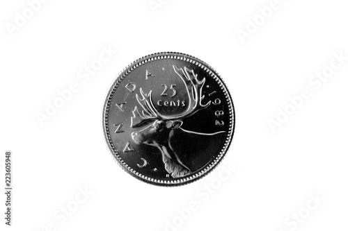 A close up image of an old Canadian quarter on a white background