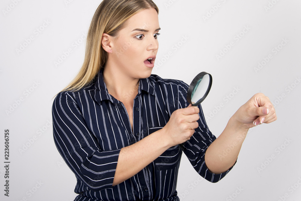 beautiful girl checking her skin with magnifier size plus model body skin care concept with magnifier beautiful girl checking her skin with magnifier size plus model body skin care concept with magnifier