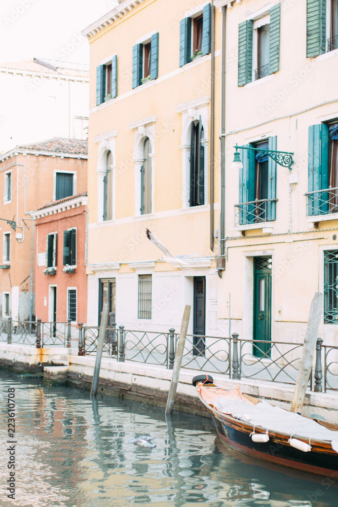 Scenic canal with bridge and ancient buildings in Venice, Italy.