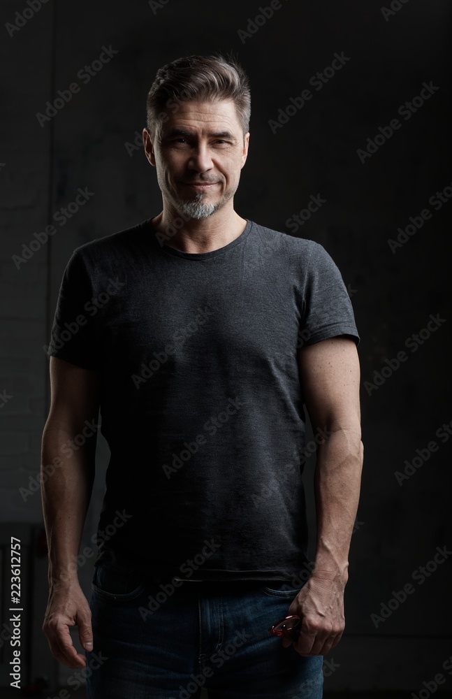 Happy older man in casual tshirt smiling