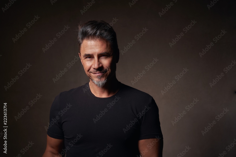 Portrait of an older white guy dark background Portrait of an older white guy dark background