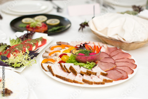 Meat assortment of beef, sausage and ham with greens