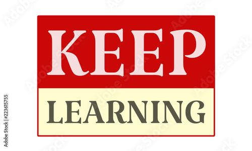 Keep Learning - written on red card on white background