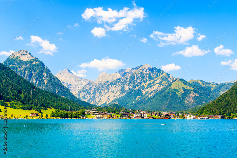 View of Pertisau village on shore of beautiful Achensee lake on sunny summer day, Tirol - obrazy, fototapety, plakaty 