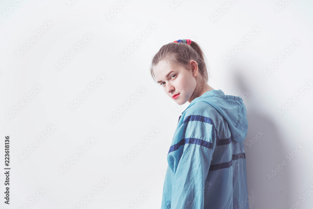Woman in uniform on white background. Sport blue trowel and pink set. Style and fashion. Retro style of 80's, 90's. Woman in uniform on white background. Sport blue trowel and pink set. Style and fashion. Retro style of 80's, 90's.