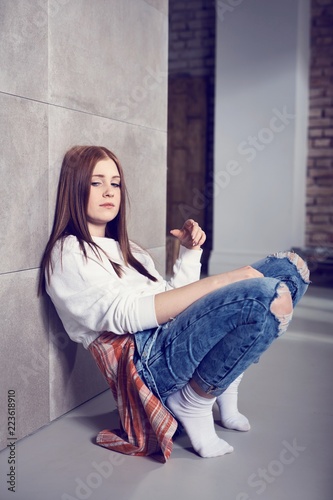 Casual girl squatting at home