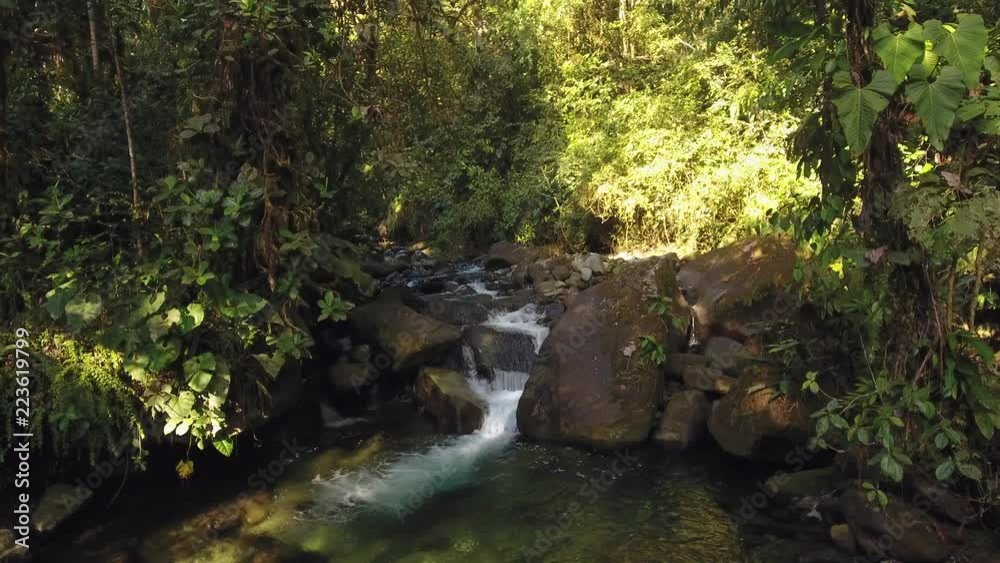 Flying over a waterfall in pristine montane rainforest at the Los Cedros Biological Reserve in western Ecuador Flying over a waterfall in pristine montane rainforest at the Los Cedros Biological Reserve in western Ecuador