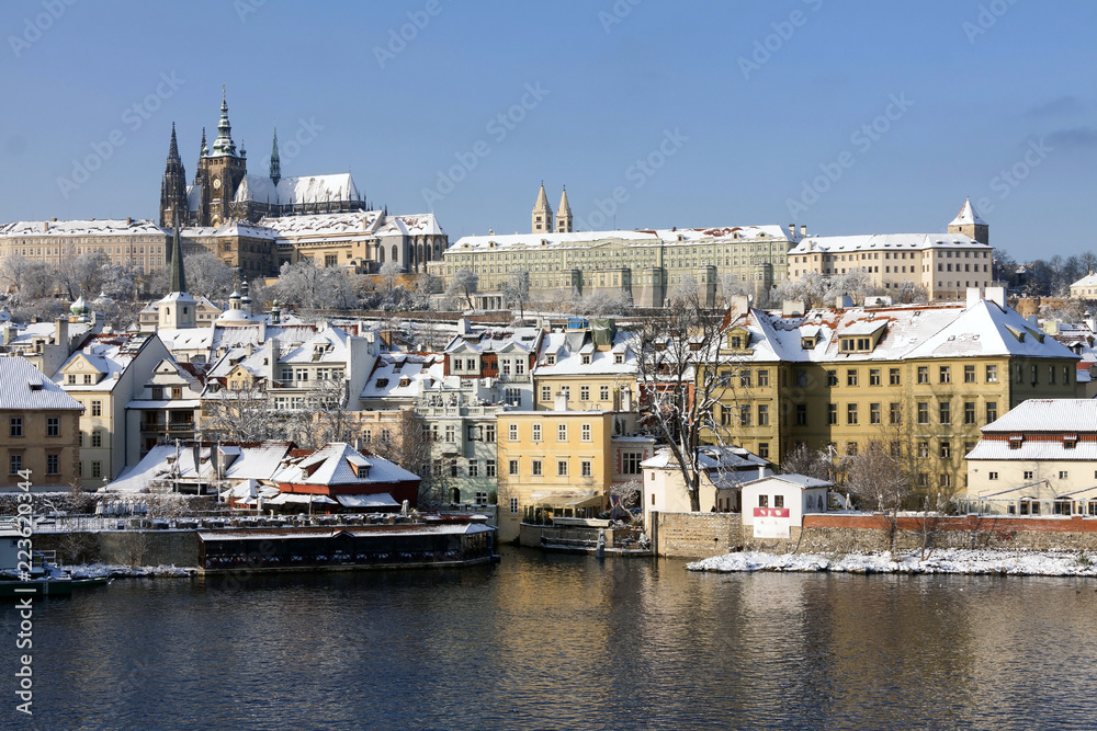 Obraz premium Christmas Snowy Prague City with gothic Castle, Czech republic