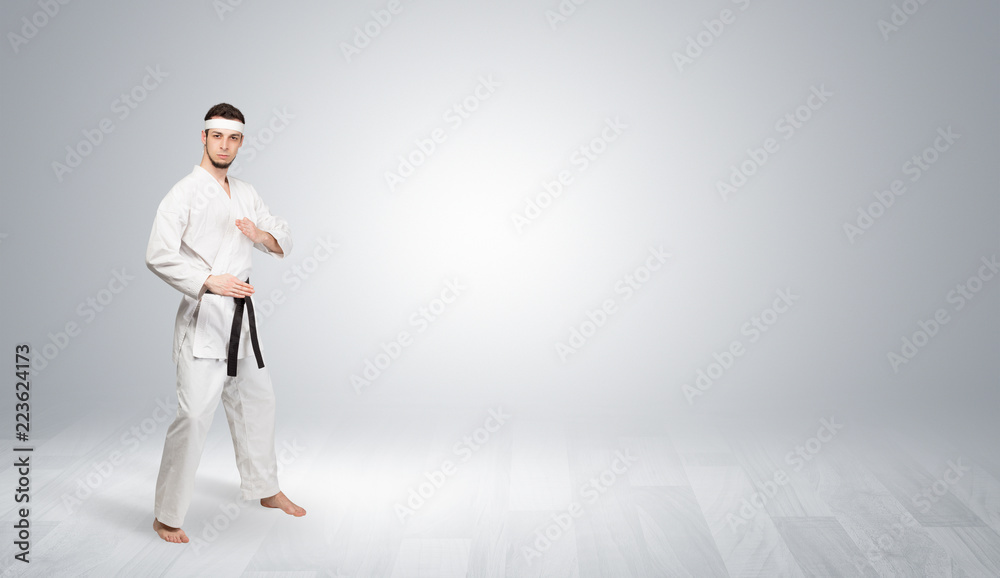 Young kung-fu trainer fighting in an empty space
Young kung-fu trainer fighting in an empty space