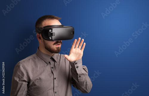 Amazed businessman with virtual reality goggles  © ra2 studio
