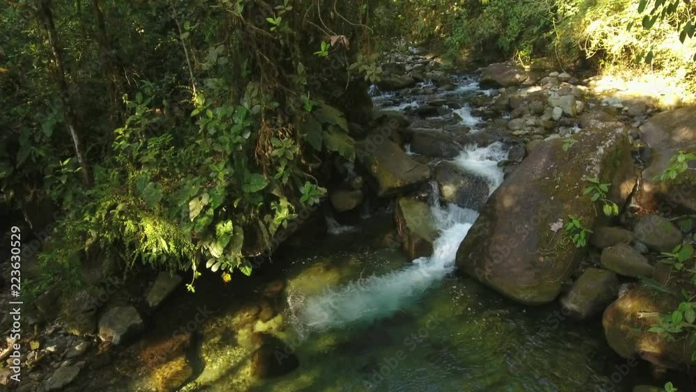 Flying over a waterfall in pristine montane rainforest at the Los Cedros Biological Reserve in western Ecuador Flying over a waterfall in pristine montane rainforest at the Los Cedros Biological Reserve in western Ecuador