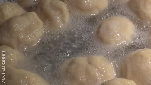 Close up cooking fruit dumplings in a pot