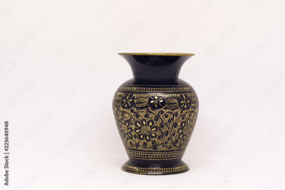 golden vase in a white background golden vase in a white background