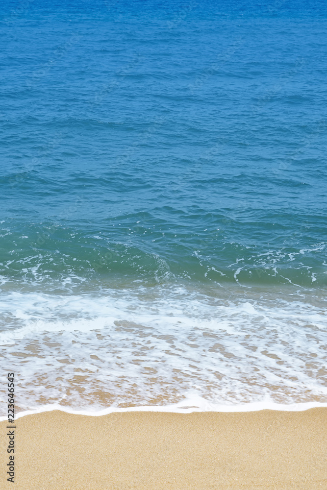 Soft wave of ocean on sandy beach