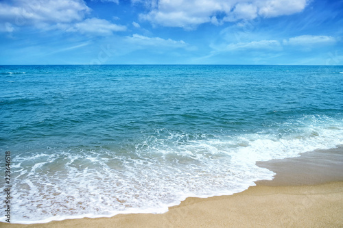 Soft wave of ocean on sandy beach