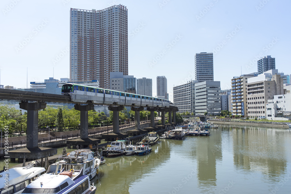Fototapeta premium view of monorail above shibaura canal tokyo