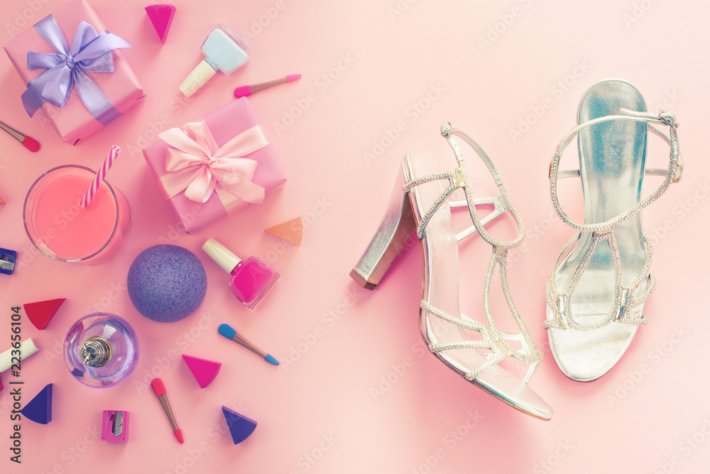 Fashion women accessories cosmetics shoes gift box bow cocktail on pink background Top view flat lay copy space
