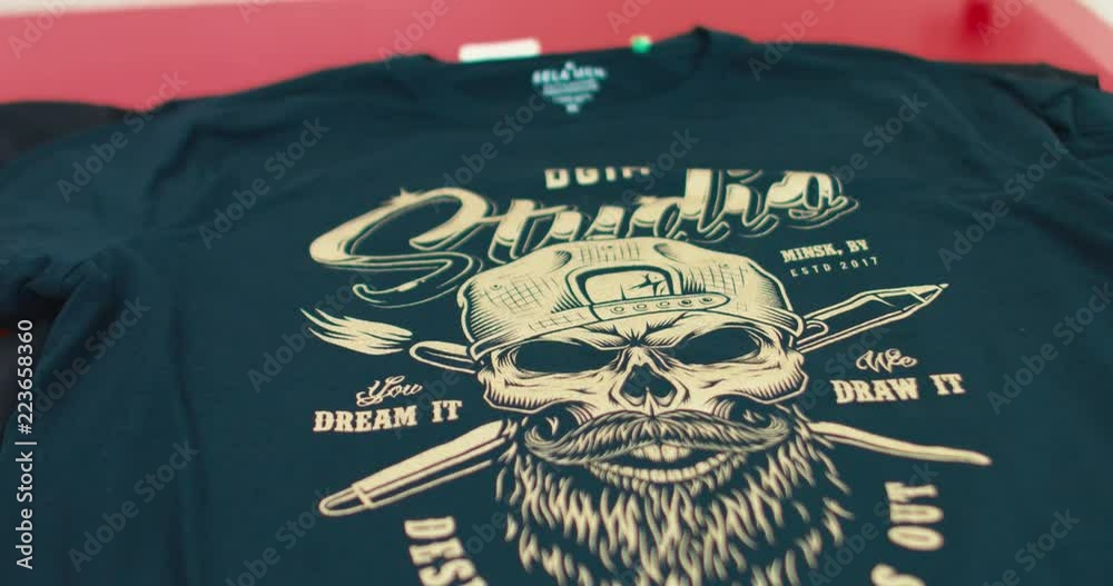 Silk screen printing process - making a print on a t-shirt. 4K UHD