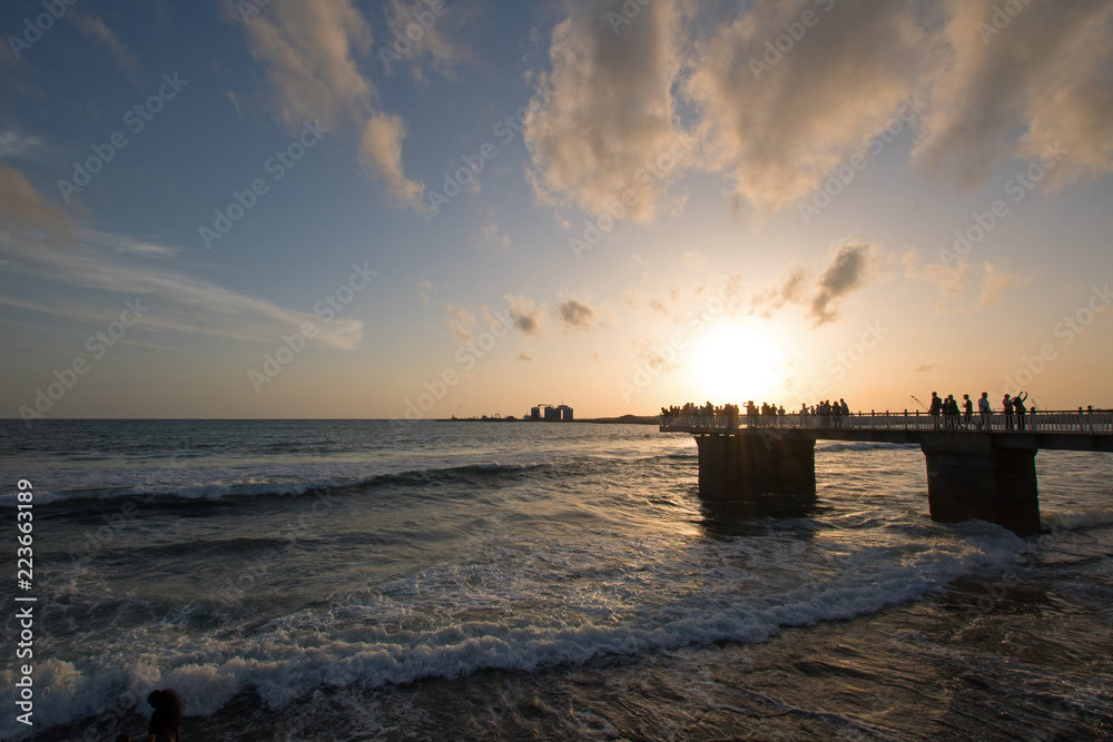Sunset over the walking pier at the Galle Face beachfront urban park area in Colombo Sri Lanka Asia