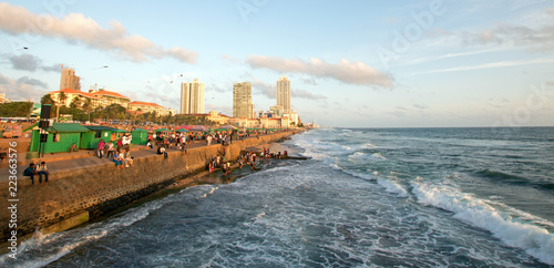 Sunset and cumulus clouds over the Galle Face beachfront urban park green area in Colombo Sri Lanka Asia