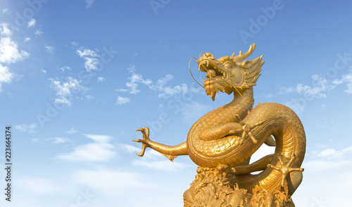 golden dragon statue at in the sky background