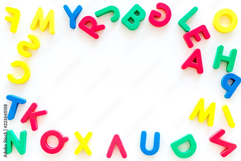 Alphabet for kids concept. English letters in disorder on white background top view copy space Alphabet for kids concept. English letters in disorder on white background top view copy space