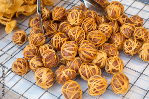 Konstfotografi Thailand traditional food Fried pork ball with noodle in market.
