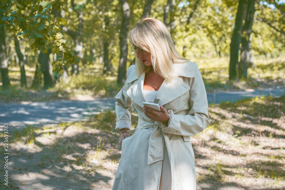Fall, nature and people concept - Young beautiful woman with dark hair have a rest in autumn time. Pretty nice woman traveler is relax. Enjoying at day, concept adventure stylish vacations outdoor Fall, nature and people concept - Young beautiful woman with dark hair have a rest in autumn time. Pretty nice woman traveler is relax. Enjoying at day, concept adventure stylish vacations outdoor