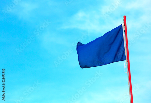 blue flag on the blue sky this is a symbol indicates clean sea photo