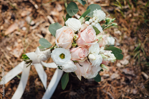 Wallpaper Mural bouquet of the bride on the ground in the forest Torontodigital.ca