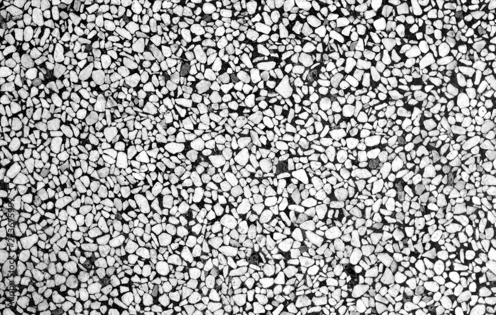 Wall made of small stones in black and white. Wall made of small stones in black and white.