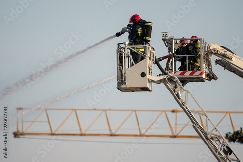 Wallpaper Mural firefighters during the action of extinguishing a powerful fire of a recycling company.Poland, Szczecin Torontodigital.ca