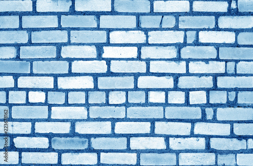 Navy blue tone old grungy brick wall surface.