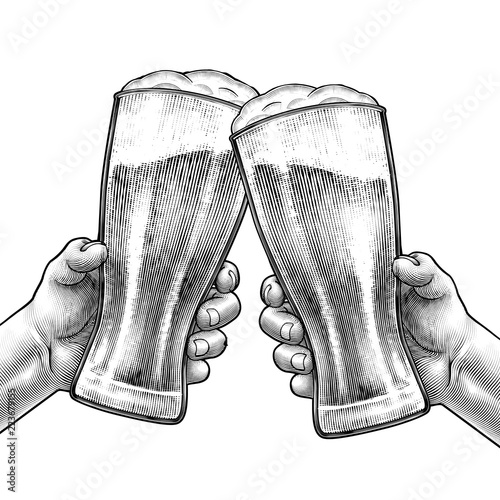 Hands holding beer glasses