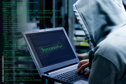 Hacker Organizes Massive Data Breach Attack on Corporate Servers with code programming in background. He is in  Secret Location. Their Hideout is Dark, Neon Lit