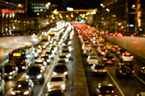 Defocused lights car traffic jam of a street road at night retro color effect for background