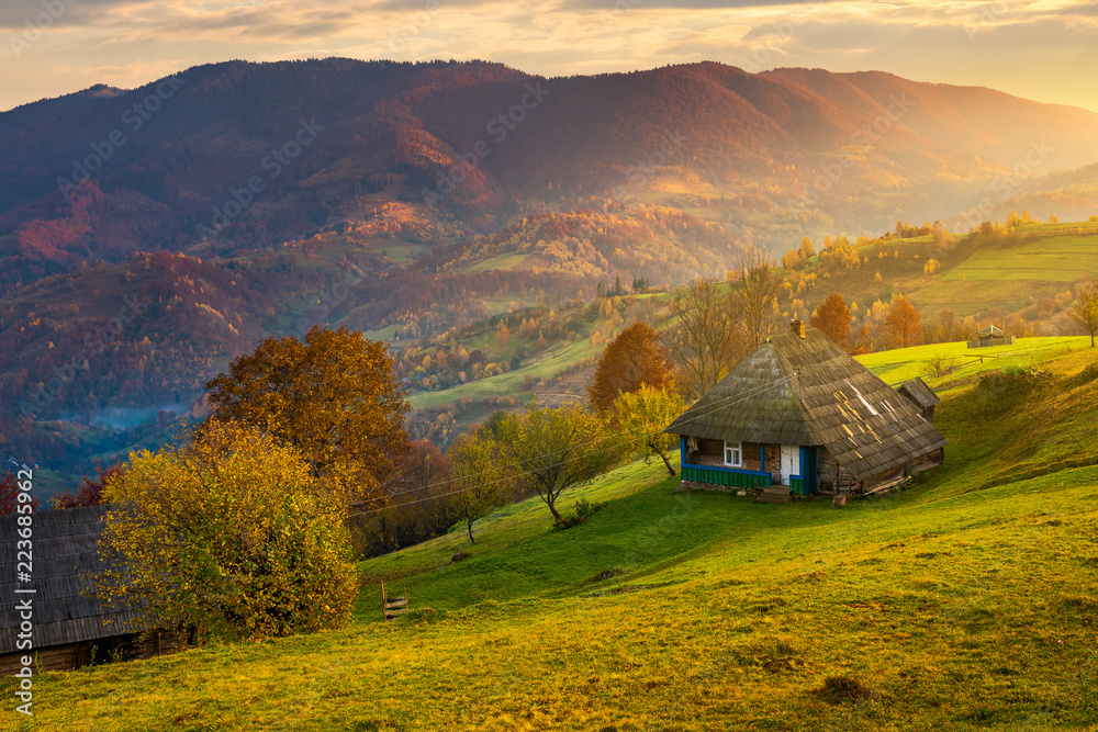 gorgeous mountainous countryside at sunrise. beautiful rural area. village on the hillside