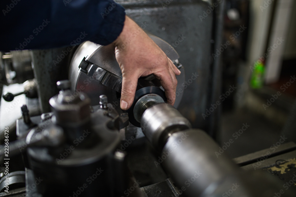 Metallurgy heavy industry. Factory for production industrial machines. Low light close up shot. Short depth of field. Metallurgy heavy industry. Factory for production industrial machines. Low light close up shot. Short depth of field.