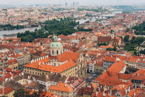 aerial view of beautiful prague cityscape with rooftops, Charles Bridge and Vltava river