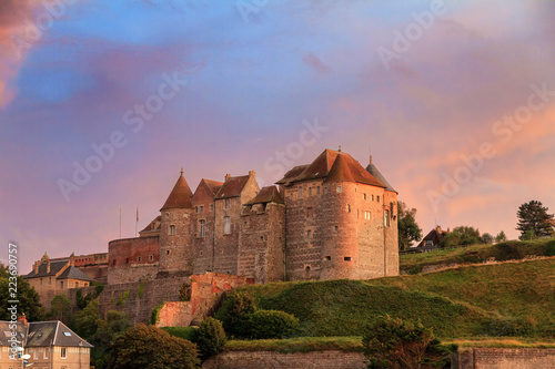 Beautiful view of Ch?teau de Dieppe at sunset in Normandy, France, with a vibrant sunset sky photo