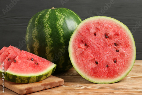 whole and slices of watermelon on the table