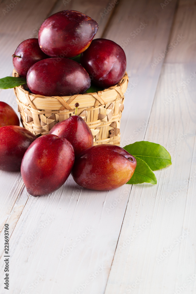 Sweet plums on wooden background Sweet plums on wooden background