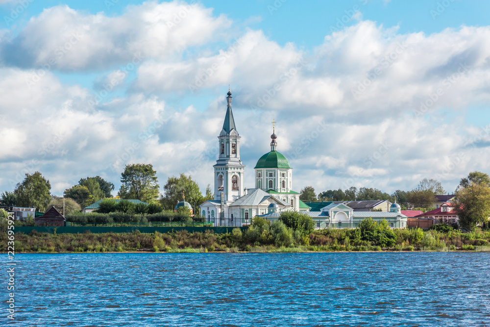 Naklejka premium St. Catherine's convent. Russia, the city Tver. View of the monastery from the Volga river. Picturesque clouds in the sky. Summer or autumn day.